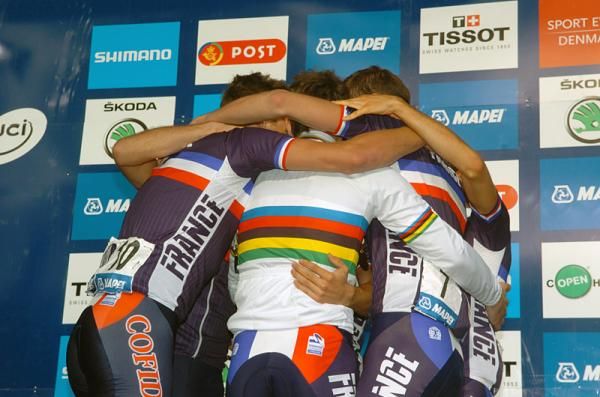The French team celebrate on the podium following their 1-2 finish in the U23 men's race.