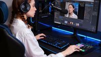 A lifestyle image of a woman using the OneOdio Solocaster in a gaming setup