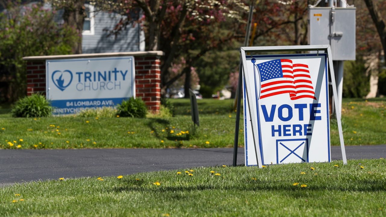 A &#039;vote here&#039; sign outside of a church in Montour County, Pennsylvania.