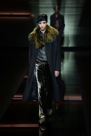 Emporio Armani Fall/Winter 2025 Menswear Collection, models take to the runway in velvet trousers, fur-collared coats and hayrides