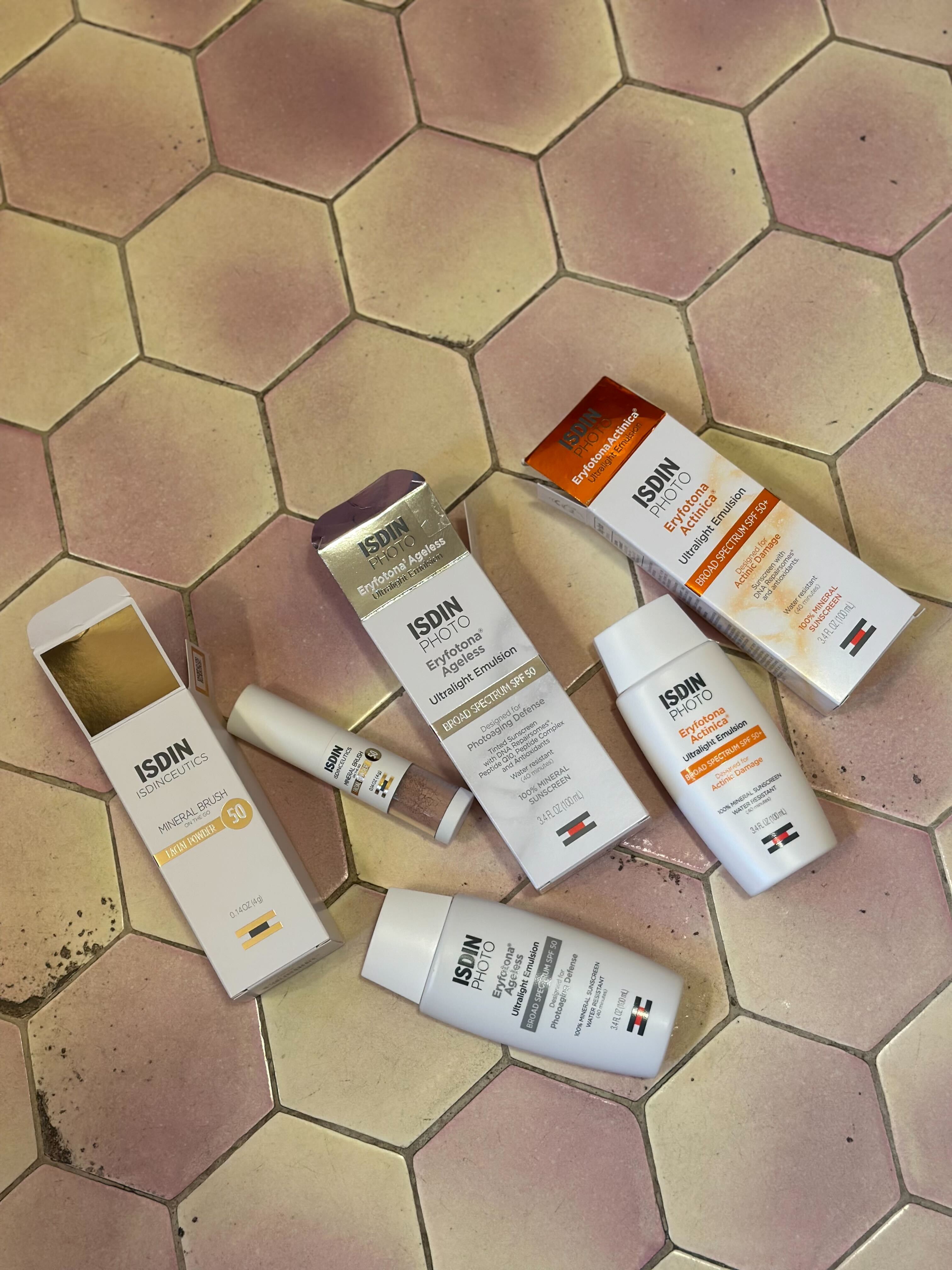 isdin sunscreens on tile floor