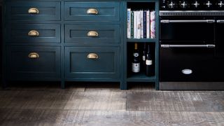 textured wooden flooriing in blue kitchen