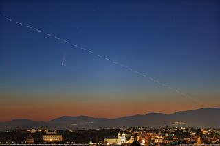 The International Space Station seems to cross paths with Comet NEOWISE in the morning sky over Rome, Italy, in this photo captured by astrophysicist Gianluca Masi of the Virtual Telescope Project, on July 7, 2020.
