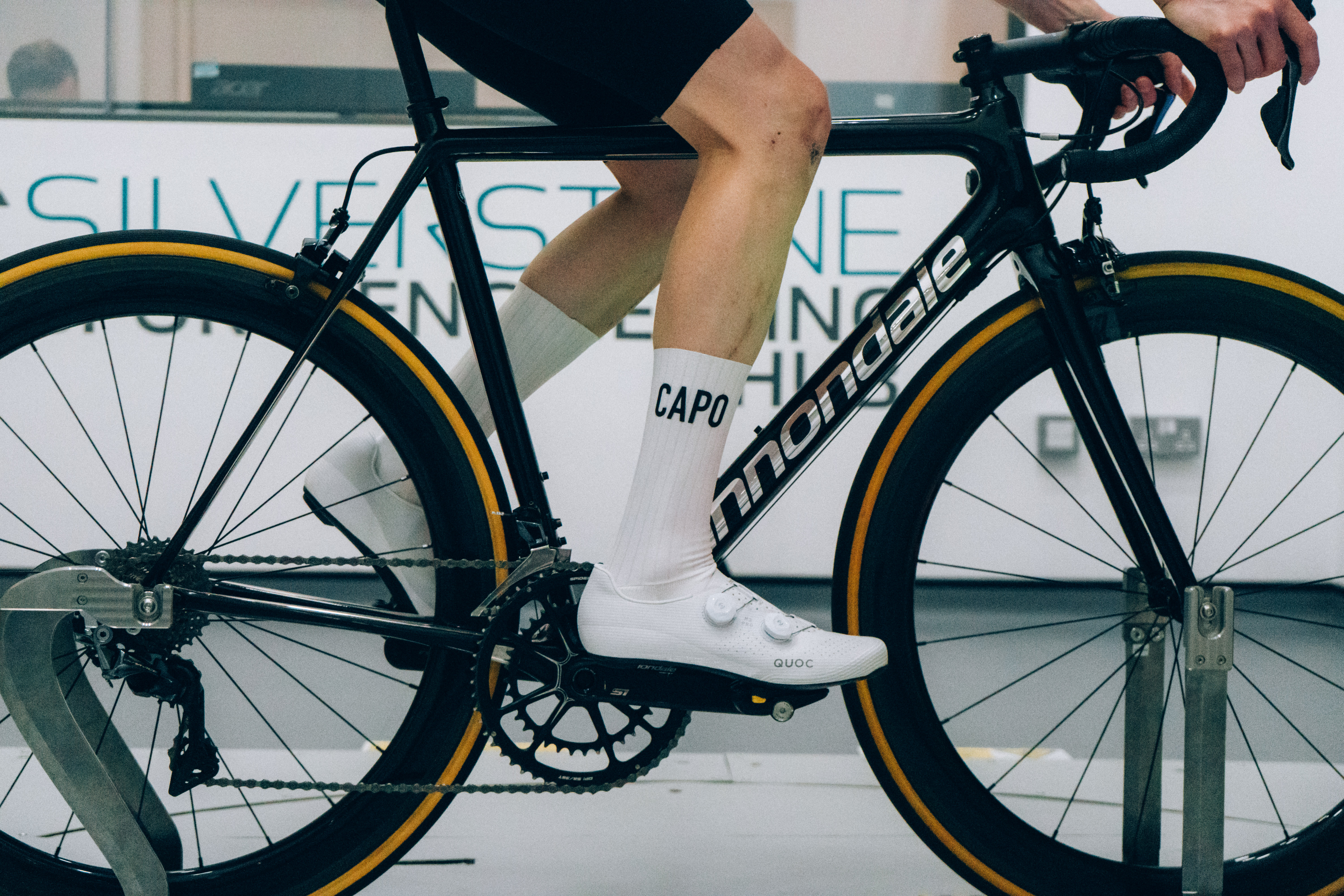 A close up of the socks that Tom is wearing while riding a bike in the wind tunnel