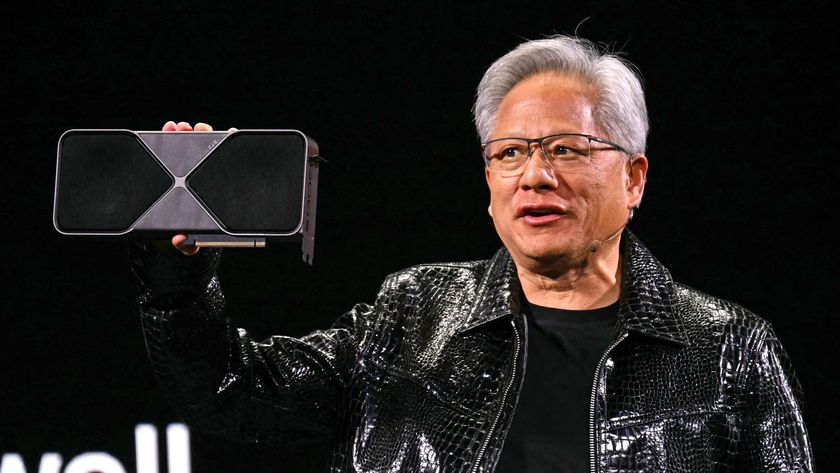 Jensen Huang holding an Nvidia RTX GPU.