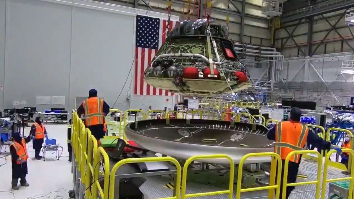 The Boeing Starliner space capsule for the Orbital Flight Test 2 test flight gets its heat shield in this still from a Boeing video released on Oct. 14, 2020.