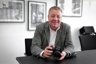 Leica VP of photo and technology, Stefan Daniel, holding a Leica SL3