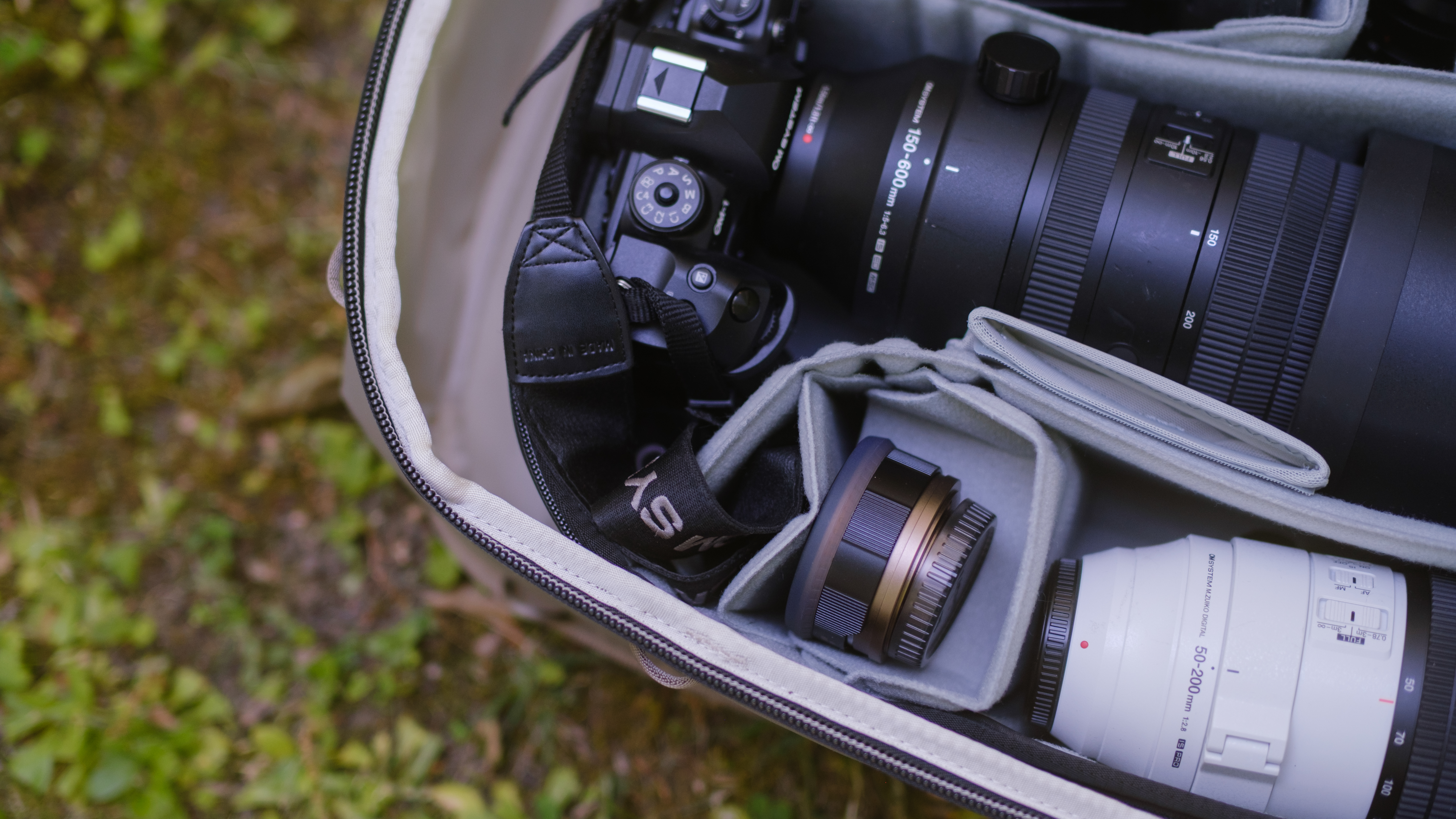 The Peak Design Travel 2-in-1 Backpack outdoors used by a photographer