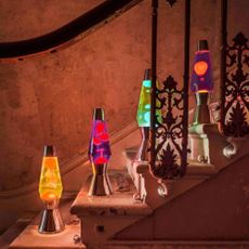 Coloured lava lamps on a staircase