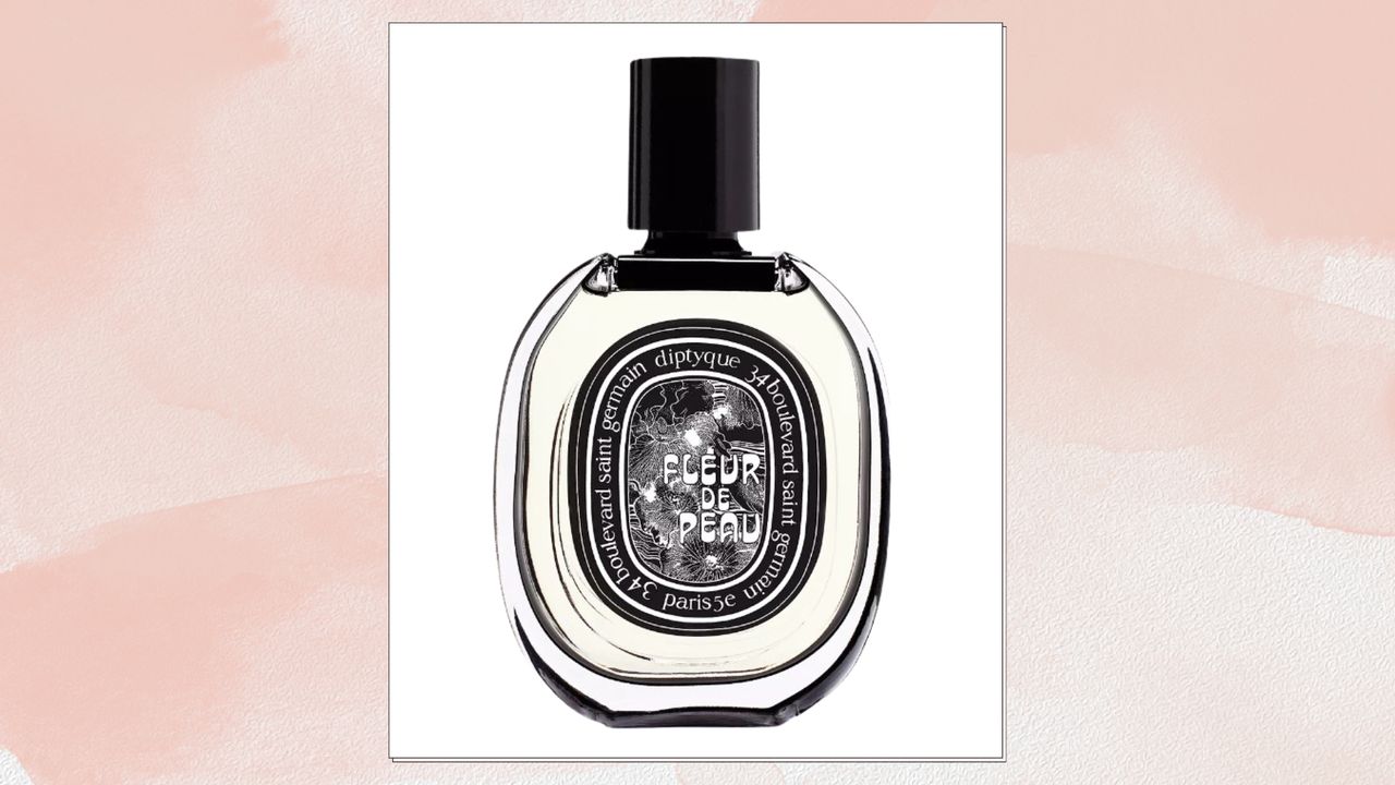 A bottle of Diptyque Fleur de Peau Eau de Parfum pictured on a peach/light pink watercolour-effect template