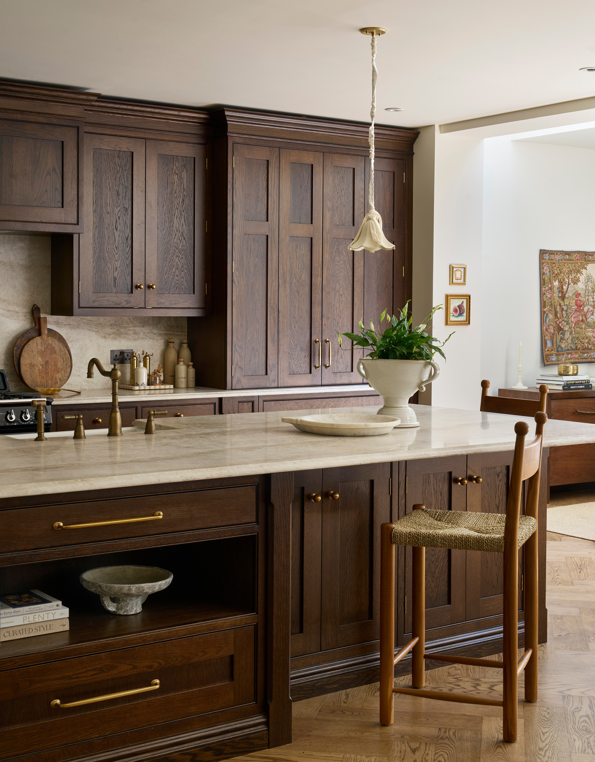 A modern, soulless kitchen transformed into a tradition, dark wooden design