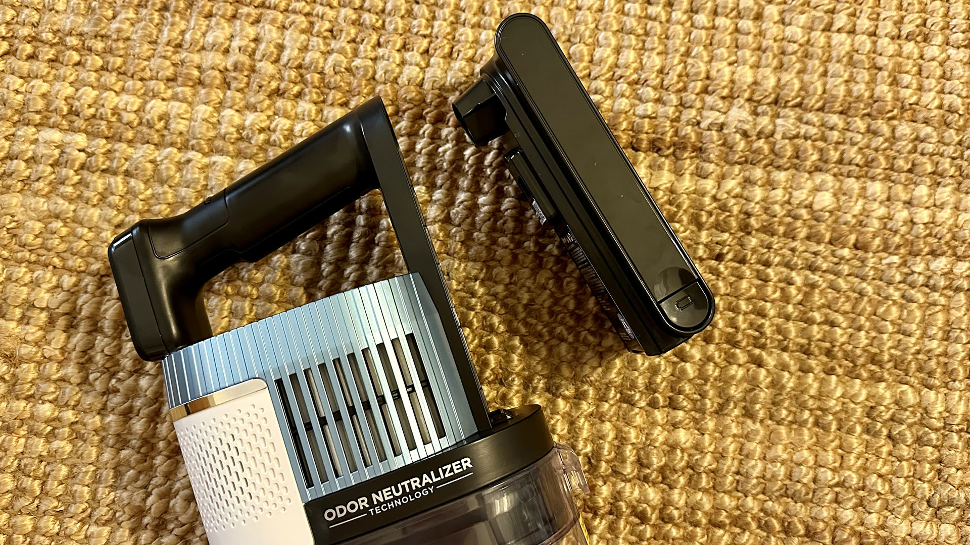 Close up of battery clipped off the Shark Cordless Pro vacuum