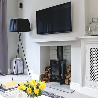 living room with white wall and fireplace