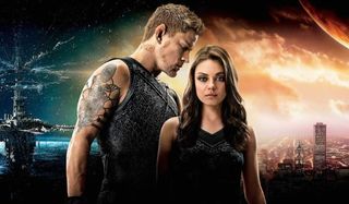 Jupiter Ascending Mila Kunis and Channing Tatum stand close in front of a sci-fi landscape