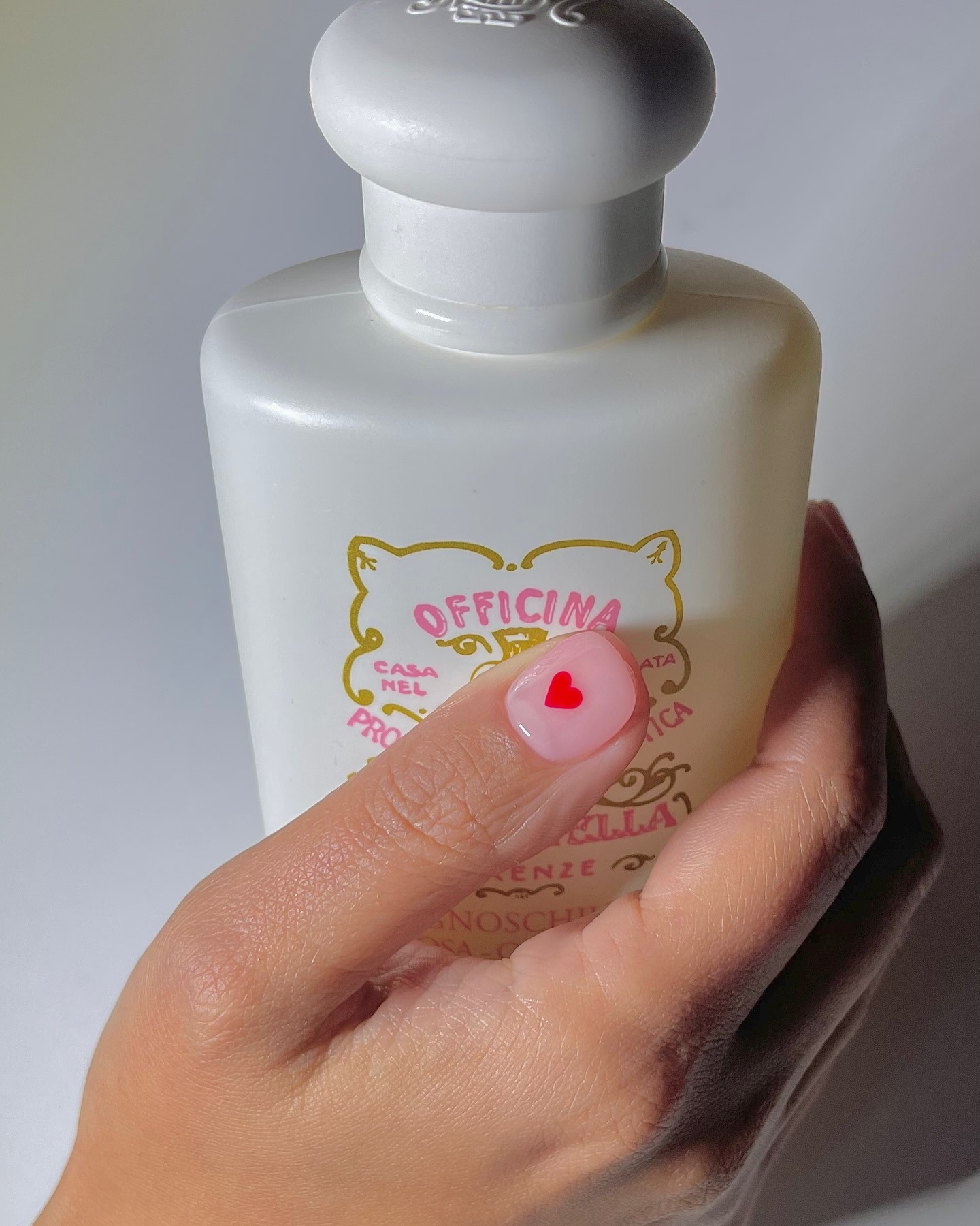 Tiny heart nail art on accent nail