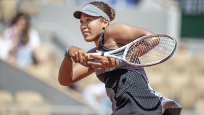  Naomi Osaka of Japan during her match against Patricia Maria Tig of Romania in the first round of the Women's Singles competition on Court Philippe-Chatrier at the 2021 French Open Tennis Tournament at Roland Garros on May 30th 2021 in Paris, France.