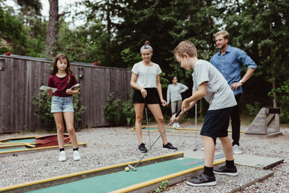 Kids enjoying crazy golf - one of the best family days out in the South East