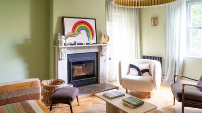 Pale green living room with wooden chevron flooring