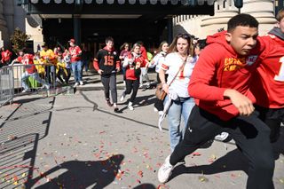 eople flee after shots were fired near the Kansas City Chiefs' Super Bowl LVIII victory parade on February 14, 2024.