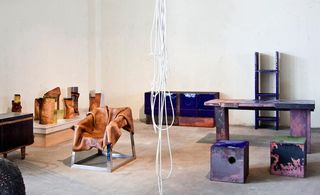 From left: Leather vessels and chair by Simon Hassan and Baked Copper and Enamel tables, cubes and cabinet by Kwangho Lee
