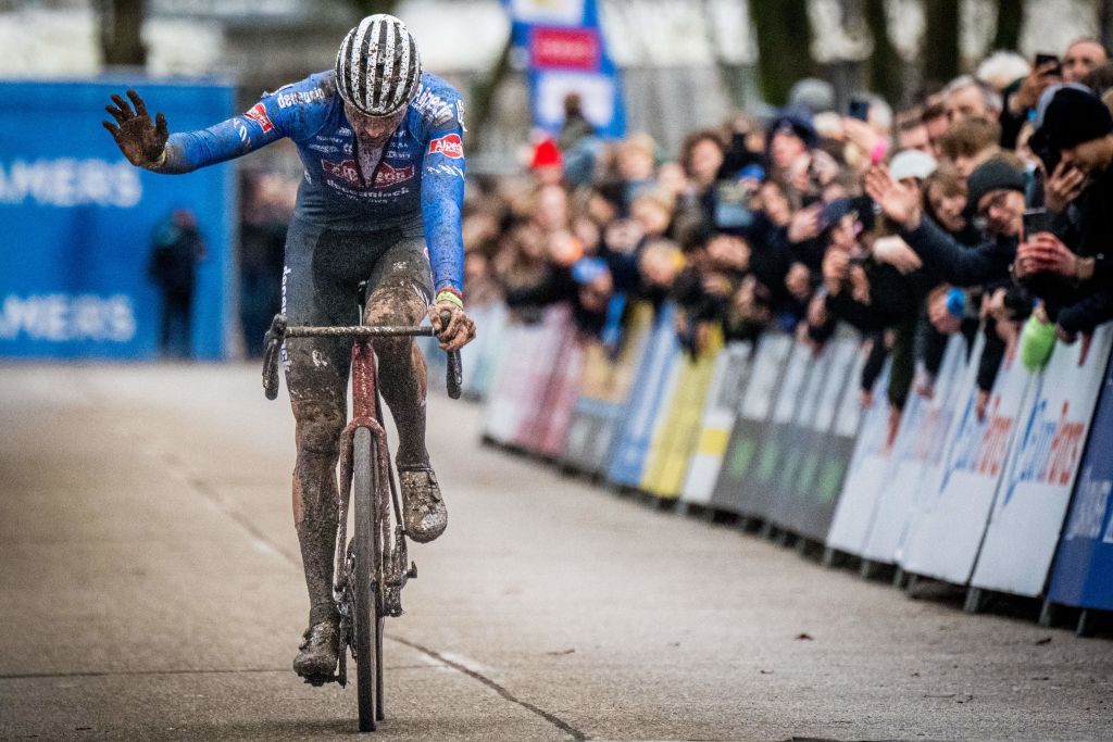 Dutch Mathieu Van Der Poel celebrates as he crosses the finish line to win the mens elite race at the Herentals Crosst cyclocross cycling event on Tuesday 03 January 2023 in Herentals the fourth stage in the X2O Badkamers Trofee Veldrijden competition BELGA PHOTO JASPER JACOBS Photo by JASPER JACOBS BELGA MAG Belga via AFP Photo by JASPER JACOBSBELGA MAGAFP via Getty Images
