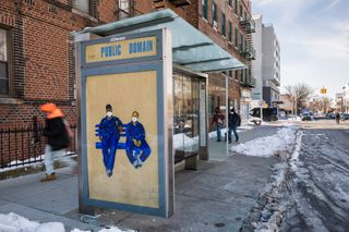 Installation image of portrait by Aya Brown on a Brooklyn bus stop, artwork is entitled 'Keasha and Ieesha'
