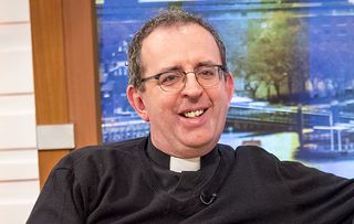 Holby City guest star Reverend Richard Coles smiling and looking relaxed