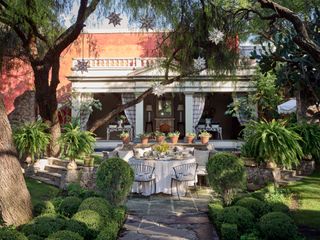 Green round bushes, stone seating area