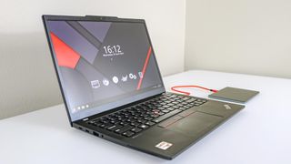 A ThinkPad laptop with the Seenda Upgraded Trackpad next to it on the right