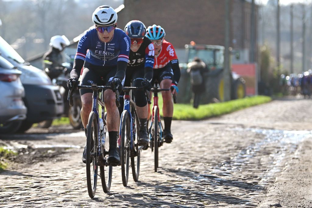DOUR BELGIUM FEBRUARY 27 LR Christina Schweinberger of Austria and Team FenixDeceuninck Vittoria Guazzini of Italy and Team FDJ SUEZ and Wilma Aintila of Filand and Team Lotto Dstny Ladies compete in the chase group during the 13th Le Samyn des Dames 2024 a 114km one day race from Quaregnon to Dour on February 27 2024 in Dour Belgium Photo by Luc ClaessenGetty Images
