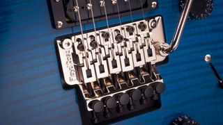 Close up for Floyd Rose 1000 installed in a blue guitar