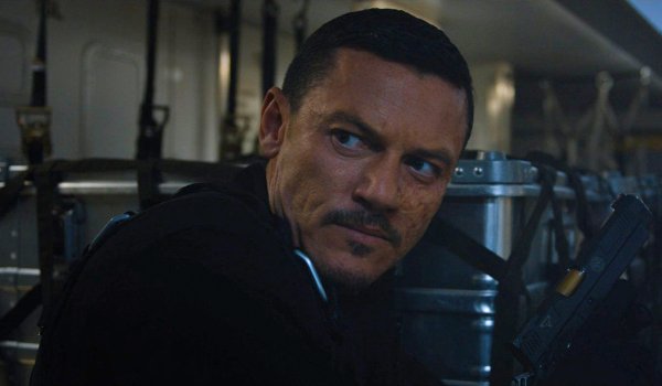 Fast and Furious 6 Owen Shaw with a gun in a plane's cargo hold