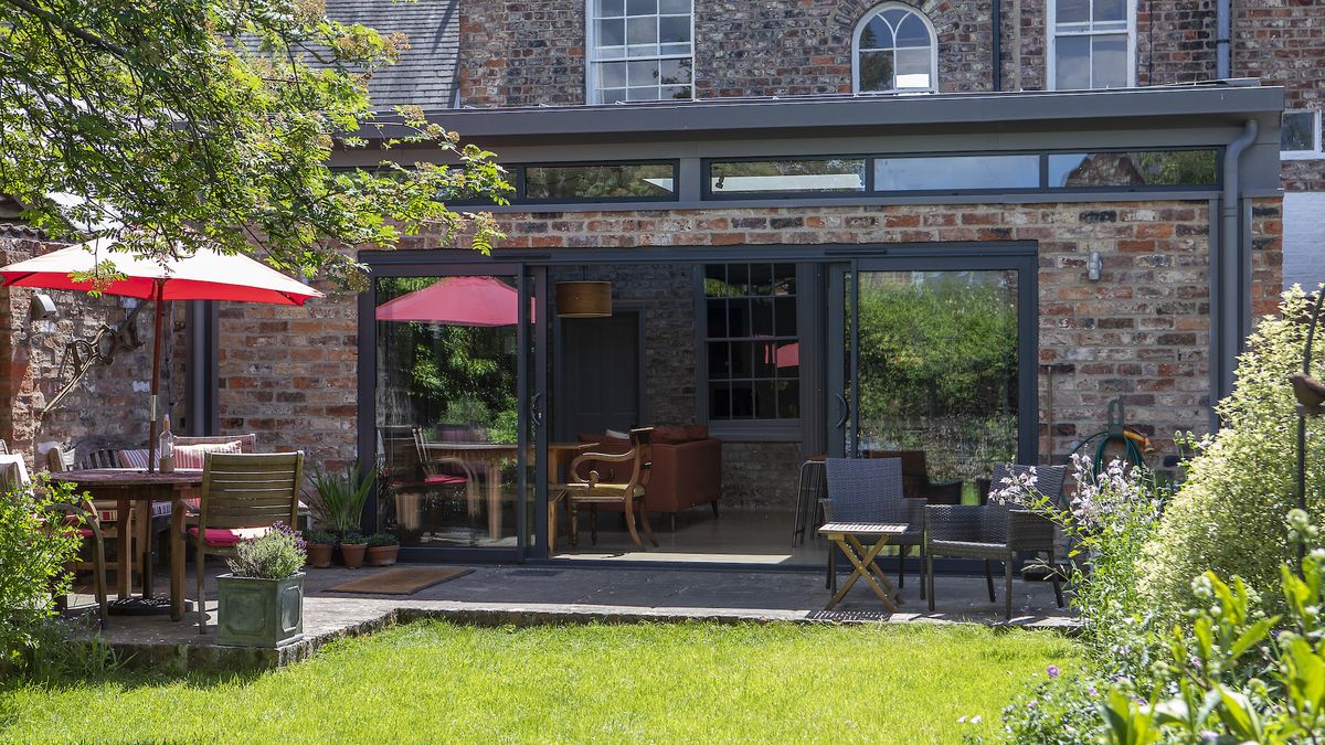 extension with lots of glazing and grass garden