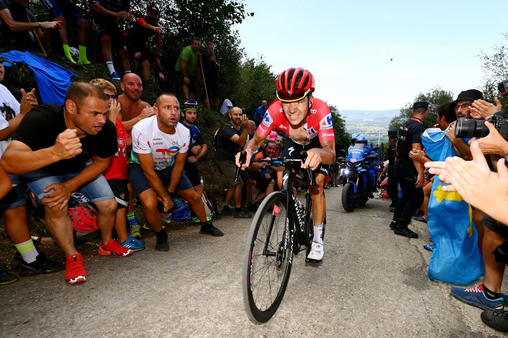 LES PRAERESNAVA SPAIN AUGUST 28 Remco Evenepoel of Belgium and Team QuickStep Alpha Vinyl Red Leader Jersey attacks while fans cheer during the 77th Tour of Spain 2022 Stage 9 a 1714km stage from Villaviciosa to Les Praeres Nava 743m LaVuelta22 WorldTour on August 28 2022 in Les Praeres Nava Spain Photo by Tim de WaeleGetty Images