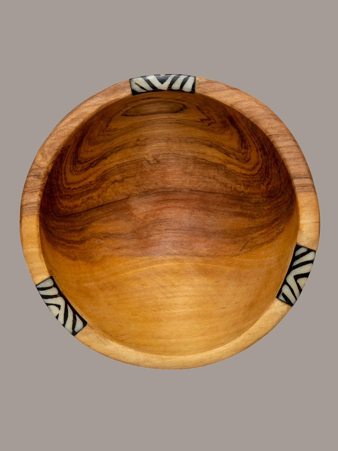 An olive wood bowl from Karakorum Crafts on Etsy