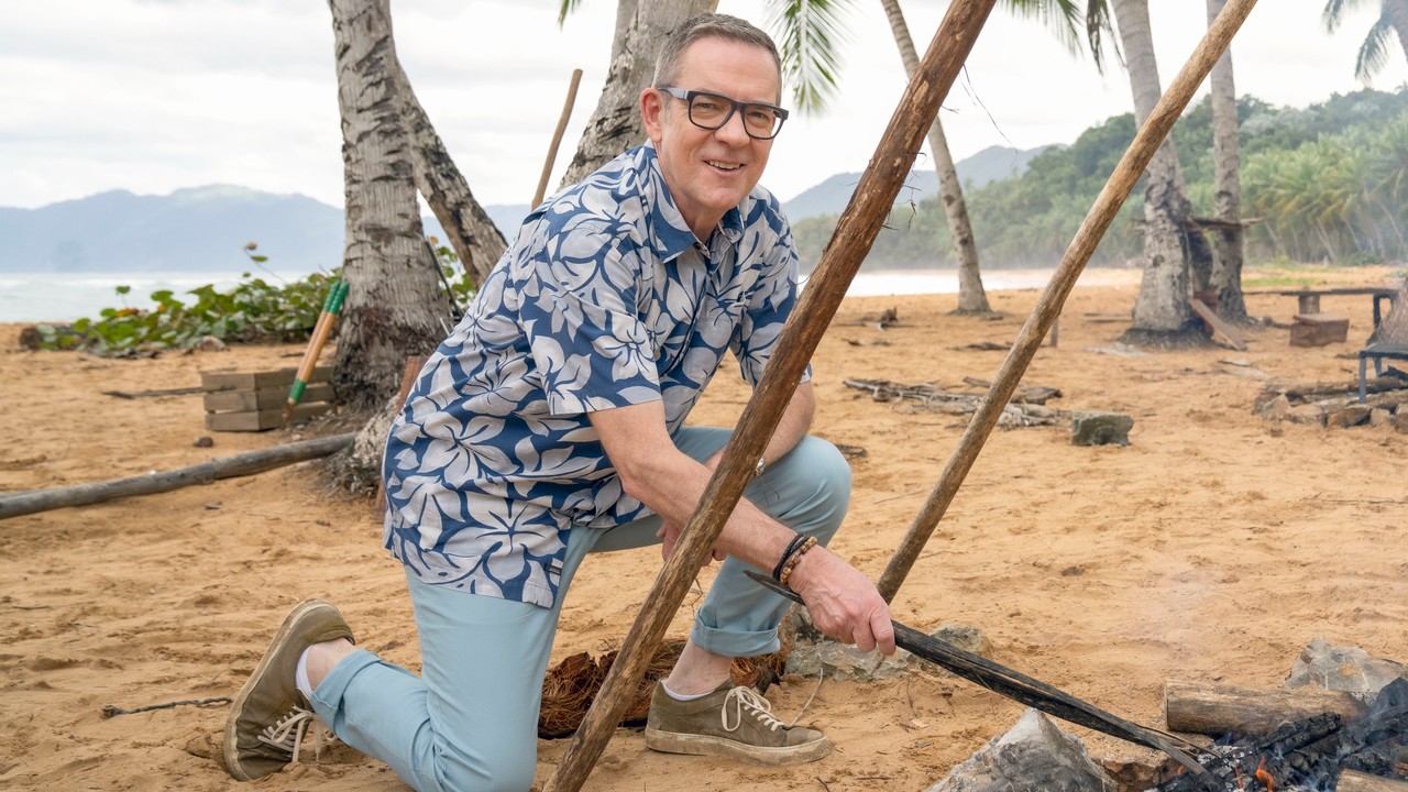 Ted Allen tending the fire on Chopped Castaways