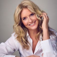 Penny lancaster headshot in a white shirt