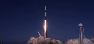 A SpaceX Falcon 9 rocket launches 60 Starlink internet satellites into orbit from Launch Complex 39A of NASA's Kennedy Space Center in Cape Canaveral, Florida on Oct. 18, 2020.