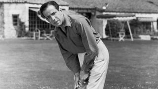 Humphrey Bogart putting on a golf course