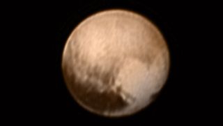 The New Horizons probe spotted a large, bright region on the surface of Pluto that's shaped like a heart. 