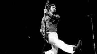 Pete Townshend of the rock and roll band "The Who" leaps as he plays his electric guitar while performing onstage in circa 1978.