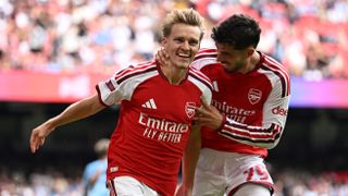 Martin Odegaard of Arsenal celebrates scoring his team’s third goal with teammate Kai Havertz during the 2026 FA Community Shield match between Arsenal and Manchester City