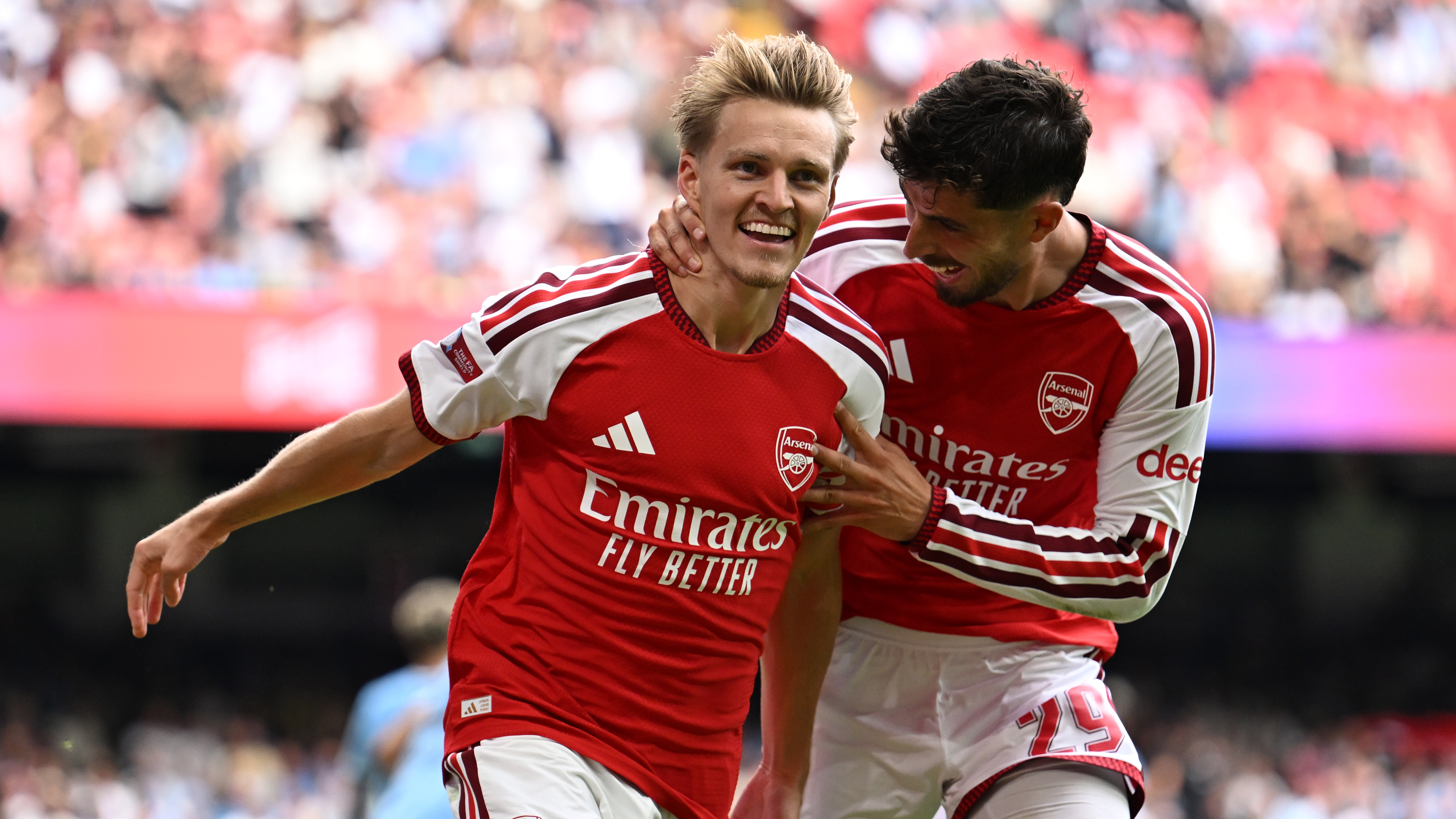 Martin Odegaard of Arsenal celebrates scoring his team&rsquo;s third goal with teammate Kai Havertz during the 2026 FA Community Shield match between Arsenal and Manchester City