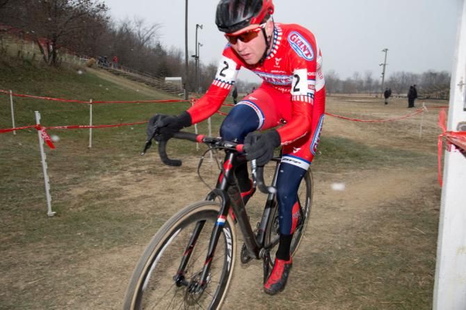 Owen flies through a corner, leading the men's field back towards the finish line