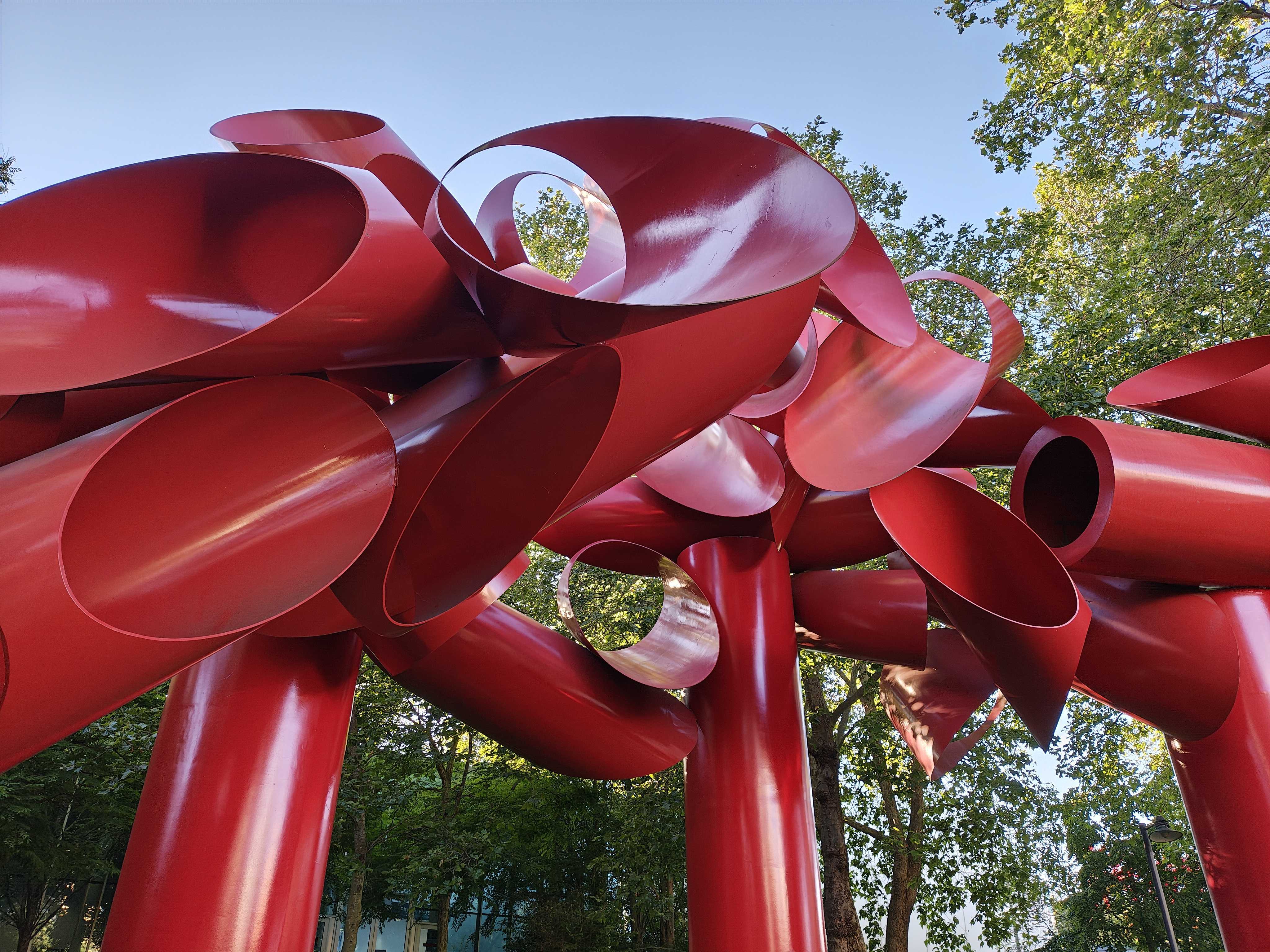 An art installation of intertwined red tubes