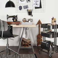 office space with sewing machine and wooden flooring