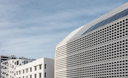 Hi-tech multi story car park with white structure