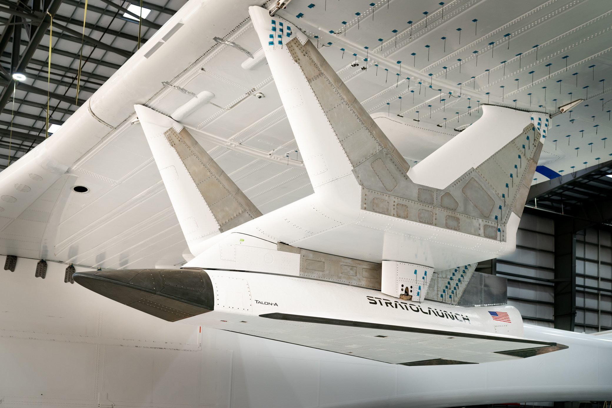 Talon-A test vehicle attached to the underside of the ROC carrier aircraft.