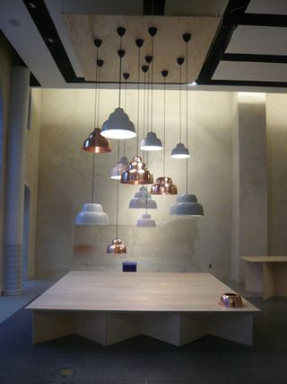 lights hanging from ceiling above a table