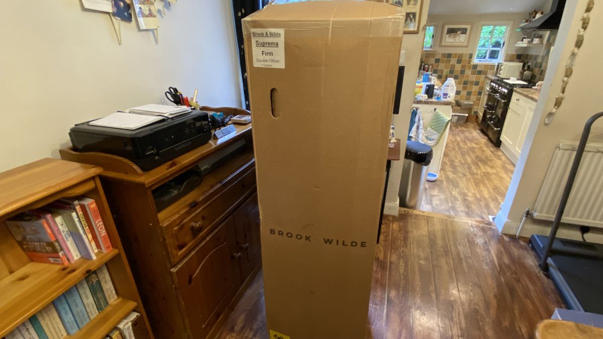 Brook + Wilde Suprema Mattress inside shipping box in our reviewer's hallway
